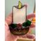Close up of Candle stained glass ornament.