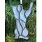 Close up of cat ornament (in gray) in Christmas Tree.