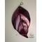 Dogwood stained glass ornament on wall.