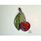 Cherry stained glass ornament on wall.