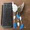 Little Angel Feathers Wind Chime next to iPad Pro keyboard for size reference.
