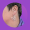 Bicycle shaped earrings on a person