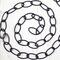 Black metal chain positioned in a spiral.