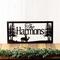 Rectangular metal family name plaque with buck and doe deer, in matte black powder coat.