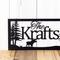 Close up of rectangular custom metal sign with moose and pine trees, in matte black powder coat.