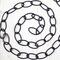 Black metal chain positioned in a spiral.