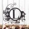 Metal monogram wall art, with fleur de lis and vines, in silver vein powder coat.