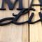 Close up of matte black powder coat on our Bullmastiffs Live Here metal sign.