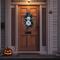 Halloween front porch decor with disco pumpkins. Handmade boho fall wreath with shimmering pumpkins and modern foliage for a trendy look.