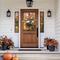 Fall wreath with velvet pumpkins and autumn leaves, perfect for adding a rustic touch to your fall door decor.