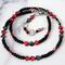 Black and red choker necklace with little hearts.