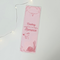 The western bookmark is on a white table with fairy lights going across on the left side