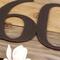 Close up of copper vein powder coat on our metal house number sign.