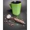 Barista coffee scoop with a stainless steel bowl and a coffee bean-infused resin handle.