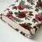 the inside of the padded book pouch matches the outside of floral book cover