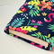 The inside of the padded book pouch matches the outside of the tropical book cover