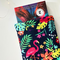 A small book peeking out of the beach book jacket