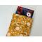 a small book peeking out of the floral book pocket