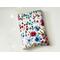 this floral book sleeve has a white background with colorful flowers