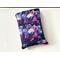 This galaxy book sleeve with pocket is sparkly with different shades of purple with planets all over the space book cover