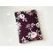 This floral book sleeve has a maroon background with red and off maroon roses