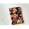 this fall kindle sleeve has a black background with fall leaves all over the autumn kindle cover
