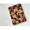 this leaves tablet sleeve has a black background with fall leaves all over the fall tablet pouch