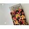 a medium size book is peeking out of the autumn book jacket