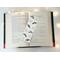 This laminated bookmark is on top of a open book