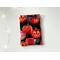 this pumpkin kindle sleeve has a black background with some pumpkins caved out and others covered in sparkly spider web