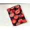 this pumpkin tablet sleeve has a black background with some pumpkins are carved out others have sparkly spider web
