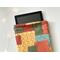 a tablet peeking out of the fall quilted tablet holder