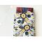 a small book peeking out of the flower book holder