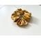 this mustard hair scrunchie has mustard yellow background with dandelions all over the ponytail