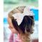 Layered white glitter bow with pink & white ghost design, with very light pink lace ribbon. Bow is approx. 5 x 2 1/2. Bow sold individually.