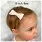 My 13 month old modeling a 3" size bow.