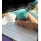 Photo of beaded blue faux fur mama pen in use. Pens are sold individually.