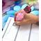 Photo of Mauve-pink pen in use. Has a focal bead that says "Small Business Babe".