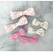 2" & 3 " size bows on 3/8" ribbon. 4 loops on each side. Top is rainbow print, to right is a colorful dash print, bottom is a stripe print. 