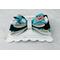 Side view of all 4 layers of the Teal & black Halloween print hair bow with loops of white ribbon. Bow is sold individually. 