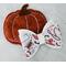 Off white glitter and faux leather print Halloween cowgirl western design hair bow. Bow is sold individually.