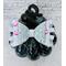 Another close up view of soft lavender glitter ribbon & faux leather hair bow. Bow is sold individually.