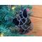 German Shepherd Ornament in Black, hanging in a Christmas Tree.