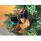 German Shepherd Ornament in Brown with Black, hanging in a Christmas Tree.