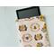 a tablet is peeking out of the bee tablet cover