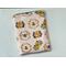 this beehive tablet sleeve has a light pink background with beehives and bees all over the insect tablet case