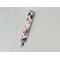 this floral keychain wristlet has a white background with colorful flowers