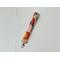 this orange keychain wristlet has a light pink background with tiny white polka dots with citrus orange all over the key strap