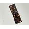 this Halloween candy bookmark has a black background with large candies surrounded by smaller candies