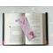this western page saver is on top of an open book with fairy lights above the book